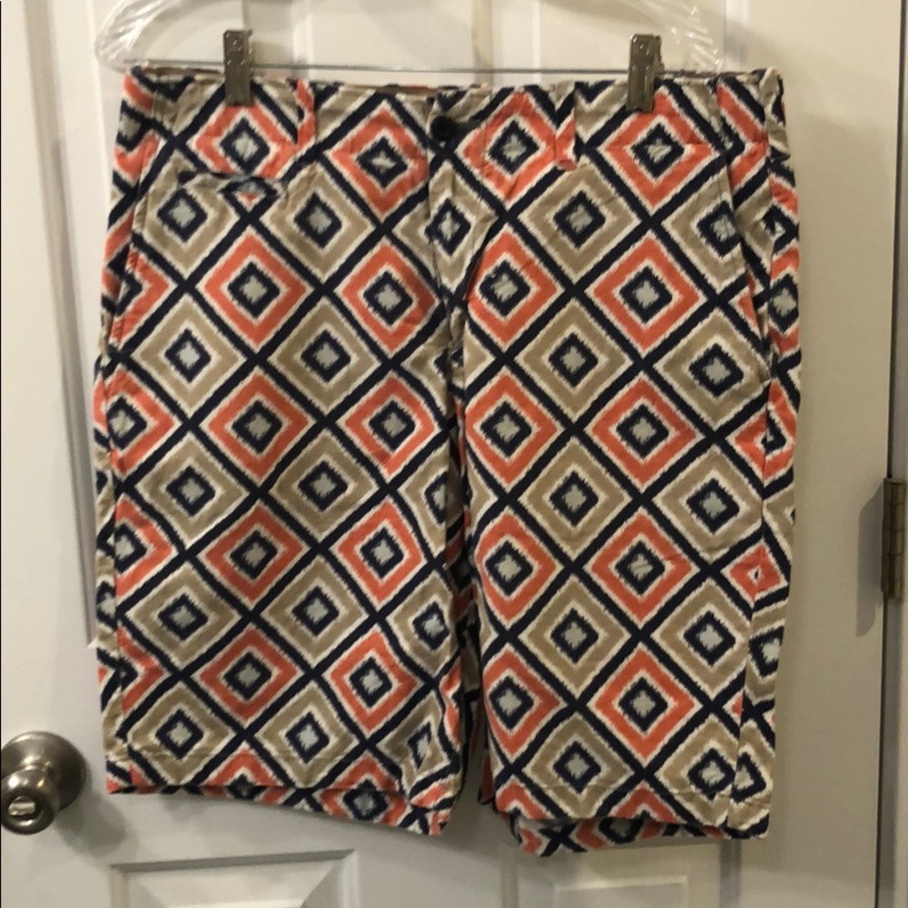 orange, navy, lt blue, and beige print short